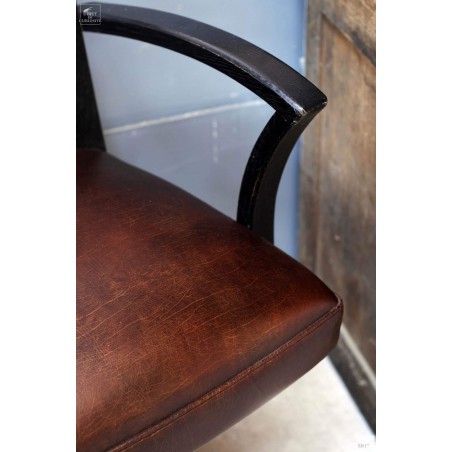 Fauteuil de coiffeur noir antique tapissé cuir