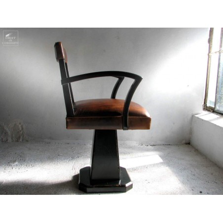 Fauteuil de coiffeur noir antique tapissé cuir