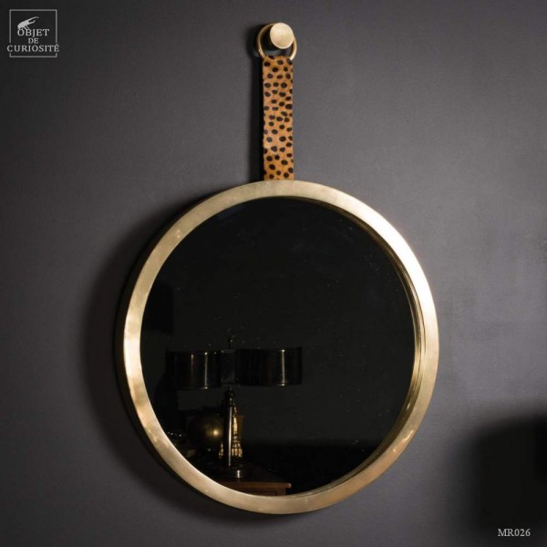 Round brass mirror, leopard decoration