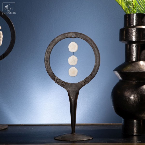 Small sand dollar in metal circle