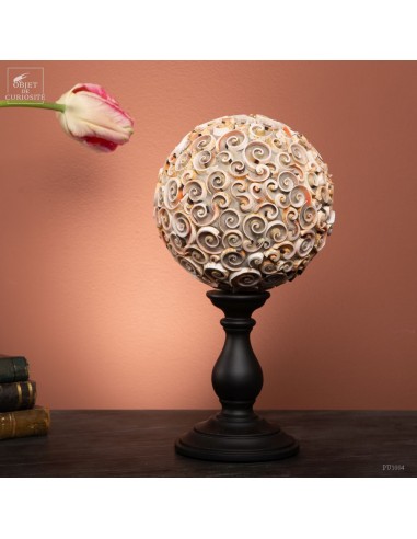 Sphere of pink shells on black base....
