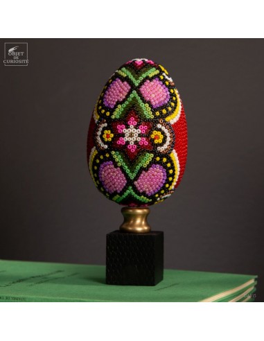 Medium beaded egg on black cube