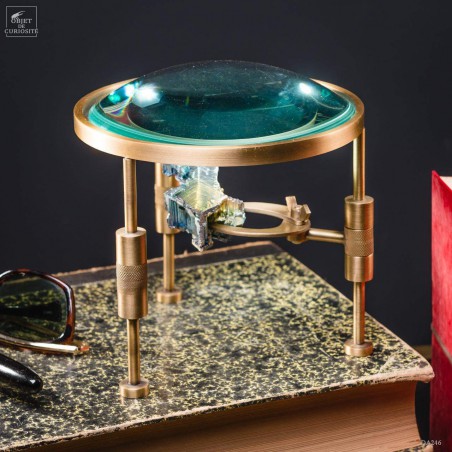 Magnifying glass on stand with bismuth
