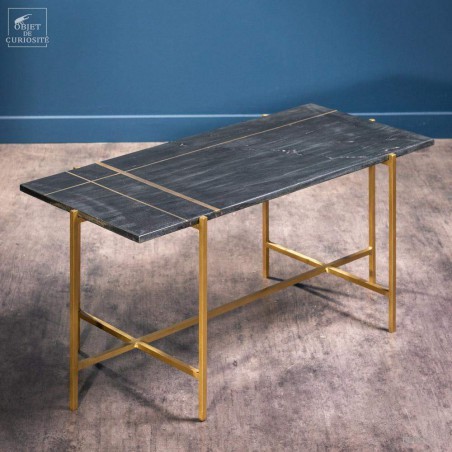 coffee table in black marble with brass lines inlay.