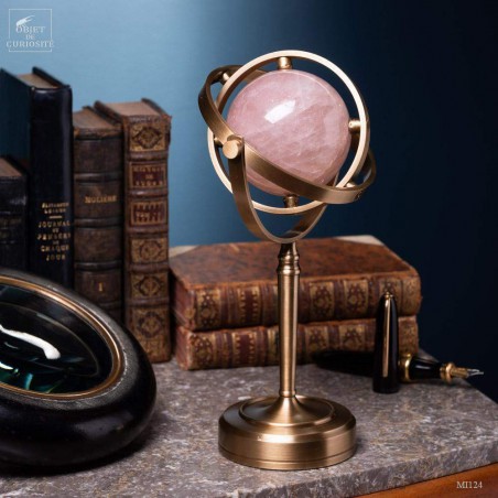Pink quartz ball, spinning brass stand