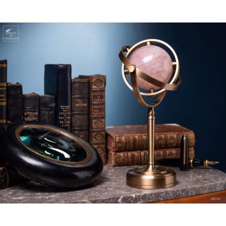 Pink quartz ball, spinning brass stand