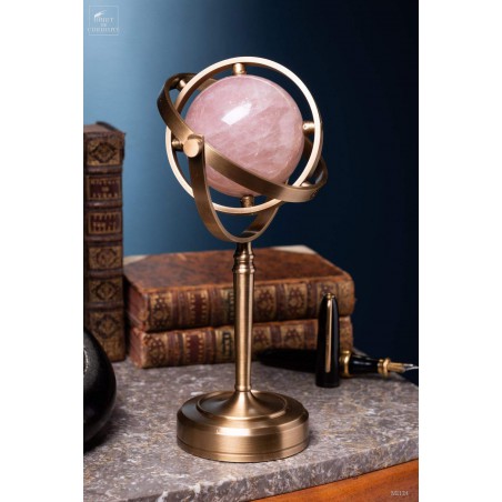 Pink quartz ball, spinning brass stand