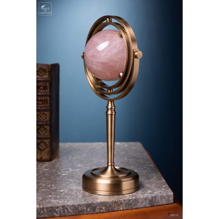 Pink quartz ball, spinning brass stand