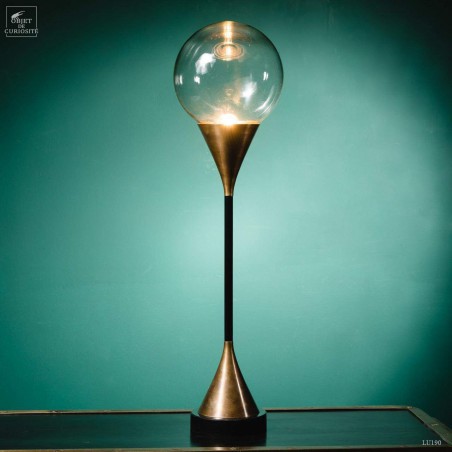 Glass ball and brass lamp