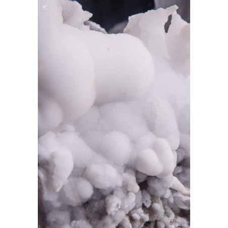 White aragonite (5.2kg) in oval glass
