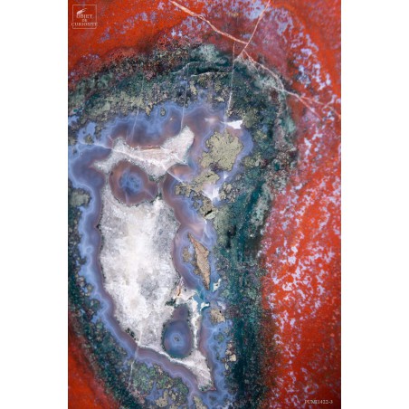 Slice of red jasper from Brazil, on black base