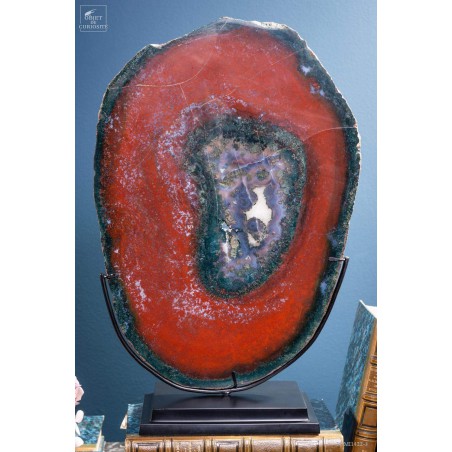 Slice of red jasper from Brazil, on black base